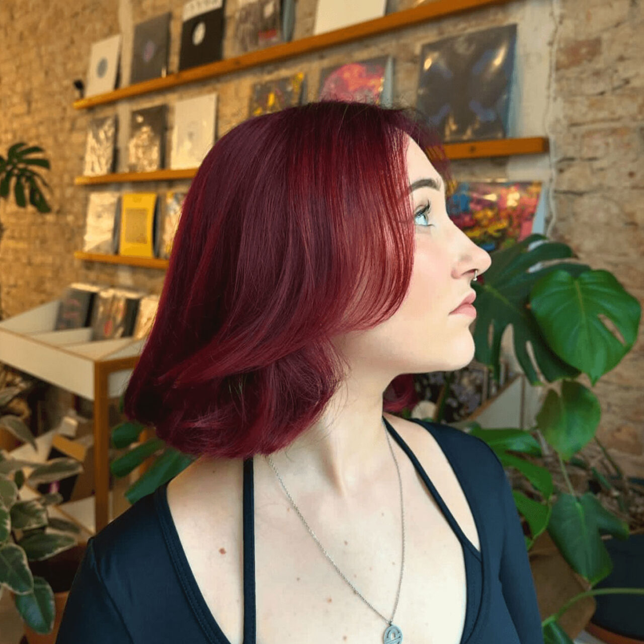 shoulderlength burgundy hair color with curtain bangs by Jimmy at ESHK Moabit Berlin