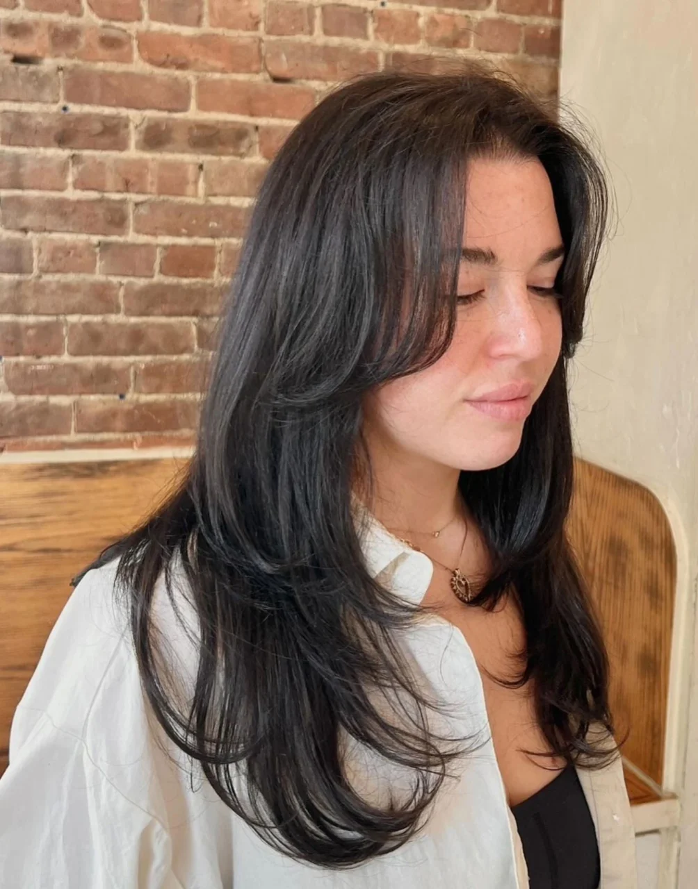 wavy layered dark brown haircut by Sarah at ESHK Hair Brooklyn NYC